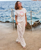 Embroidered top with buttons down the back in off white
