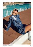 Denim blouse with frill and white flower appliqué