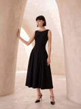Sleeveless dress in black crêpe with chain detail.
