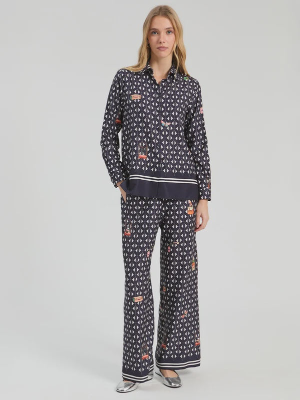 Straight leg trousers with geometric print on navy background