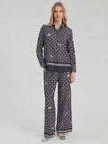 Straight leg trousers with geometric print on navy background