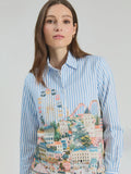 Vertically striped shirt in blue and white with panoramic illustration