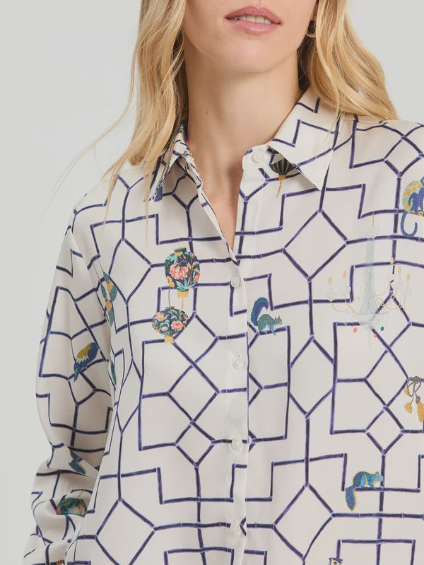 White shirt with geometric print in navy and fun motif all over.