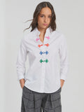 White long sleeved shirt with frogging
