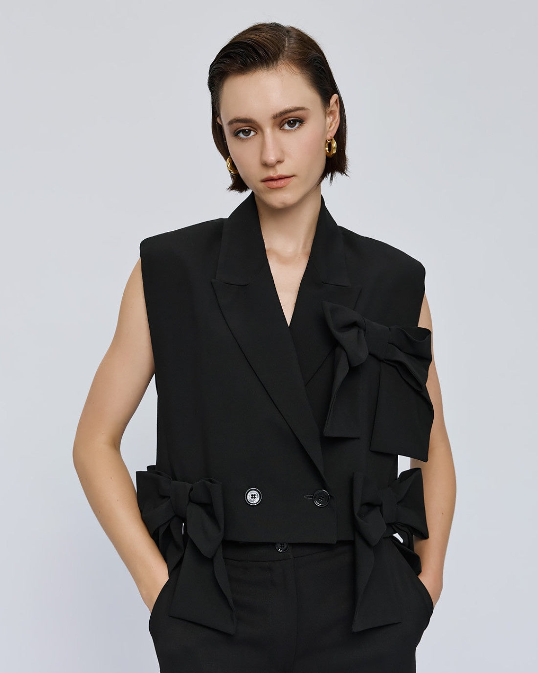 Black waistcoat with bows detail