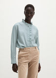 Long sleeve blouse in glacial blue with ruffle trim