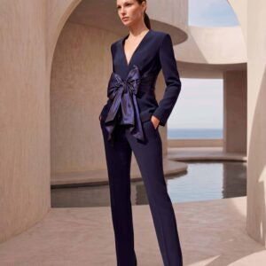 Navy 2 piece trouser suit with v neckline and large taffeta bow on the waist