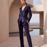 Navy 2 piece trouser suit with v neckline and large taffeta bow on the waist