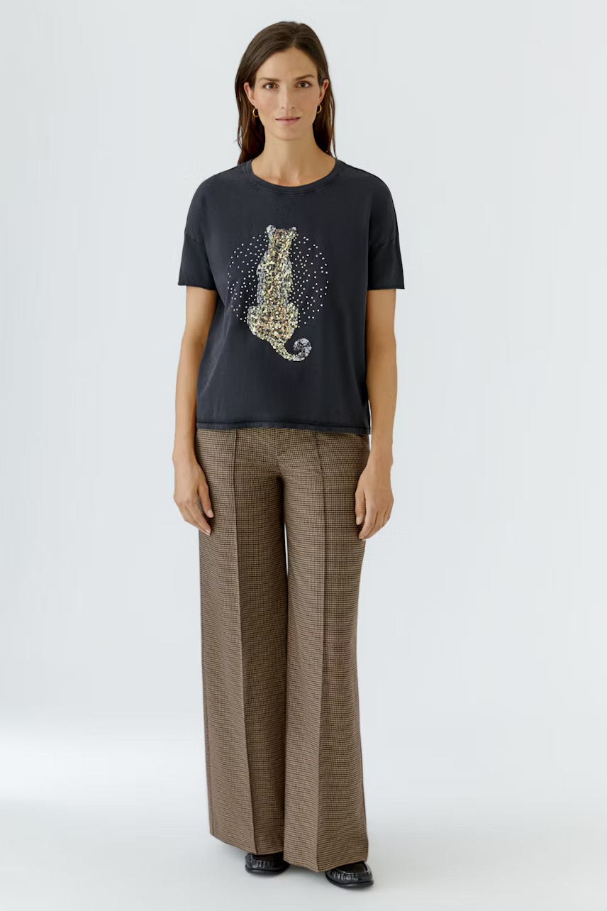 Washed black T-shirt decorated with sequins