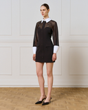 Black dress with sheer detail and buttons with white collar and attachable cuffs