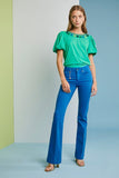 Green t-shirt with green and blue tassels