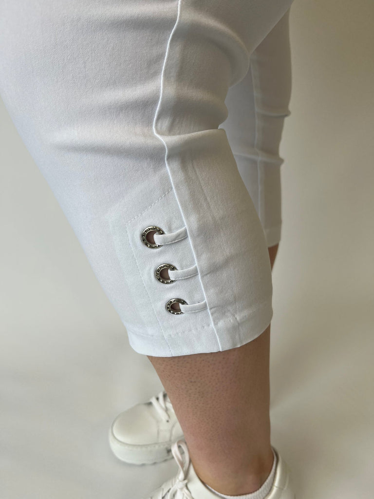Cropped white trousers with diamond eyelet at hem