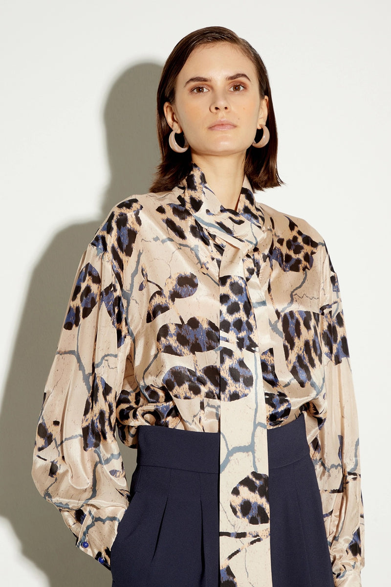 Beige printed blouse with bow neckline