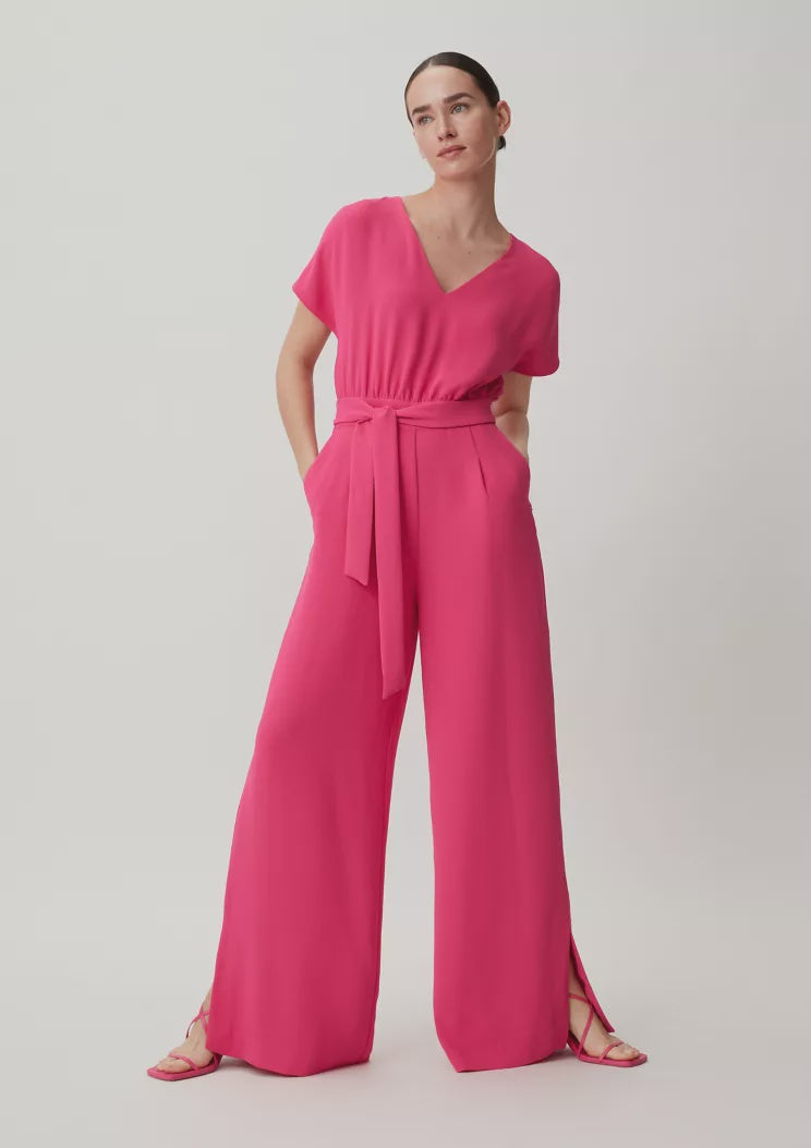 V neck jumpsuit in raspberry .