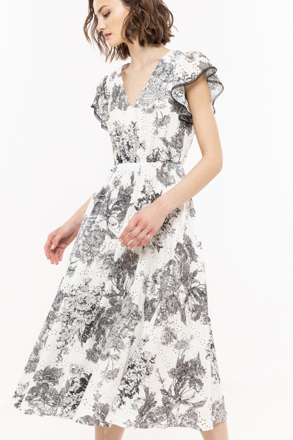 White broderie dress with black floral pattern